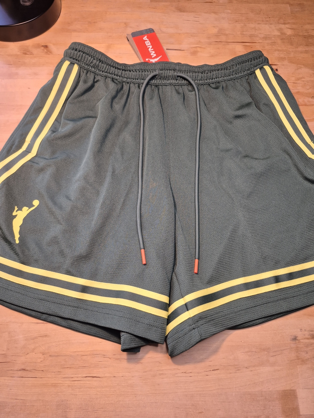 Nike Women's WNBA Green Athletic Shorts with Yellow Stripes